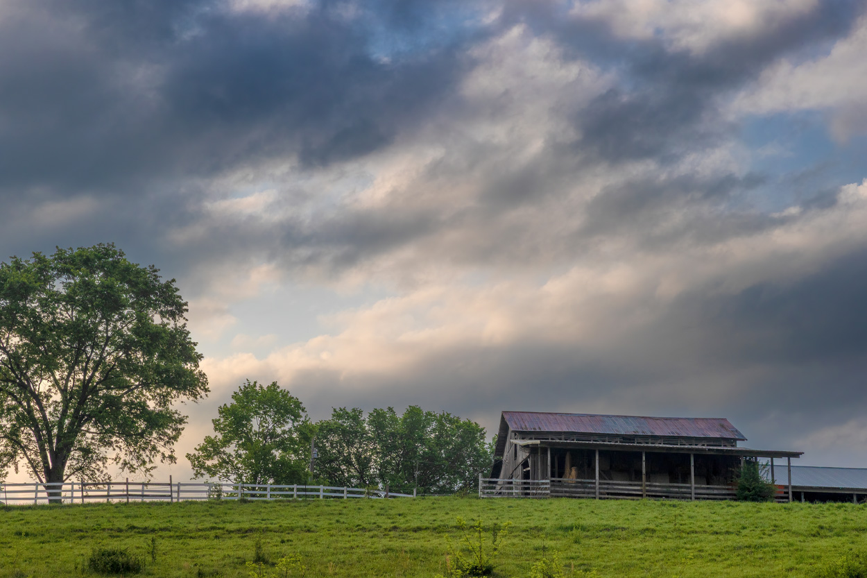 Historic rural barn beneath dramatic storm clouds near Bulls Gap, Tennessee