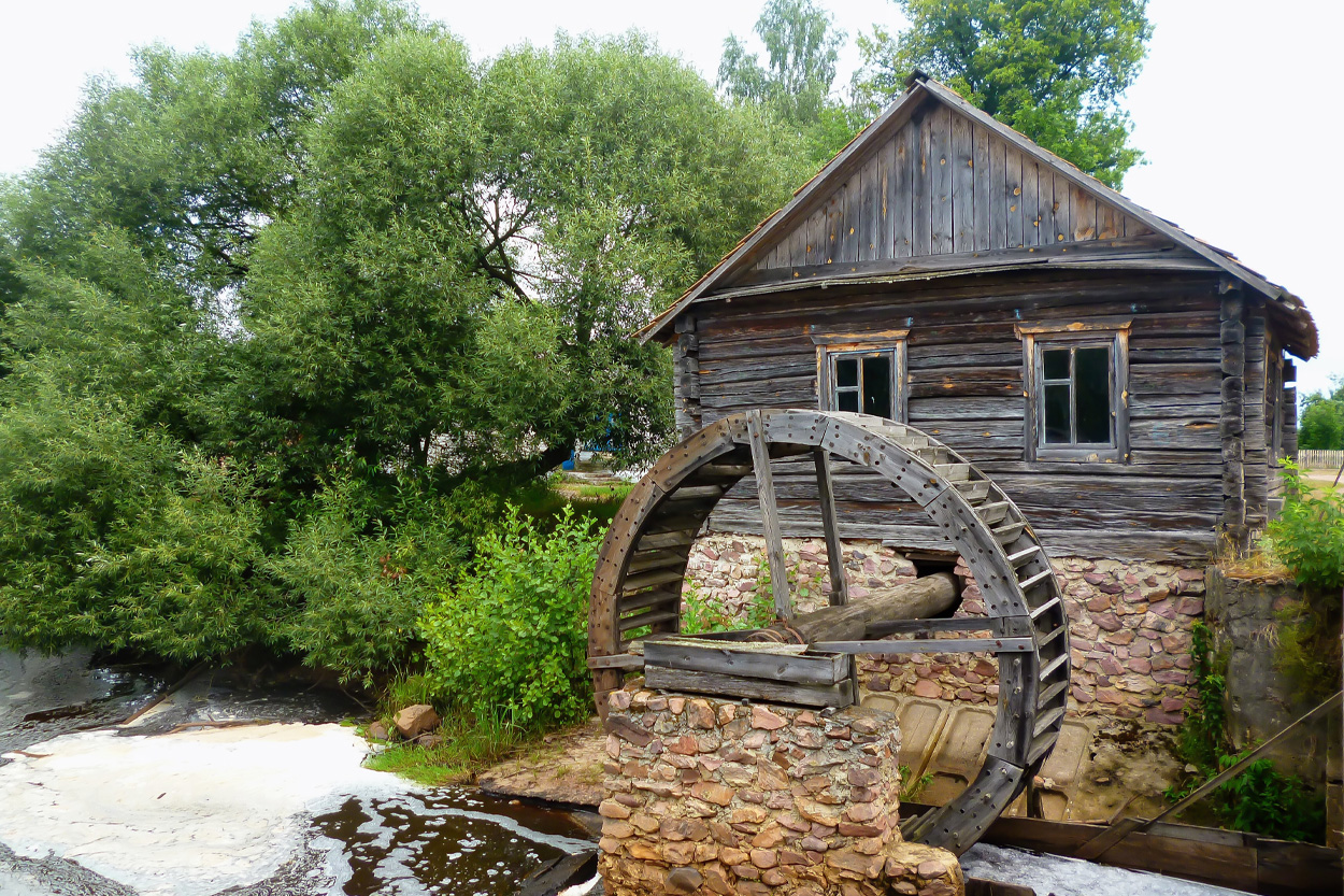 Rustic wooden watermill surrounded by trees in Chestnut Hill, Tennessee