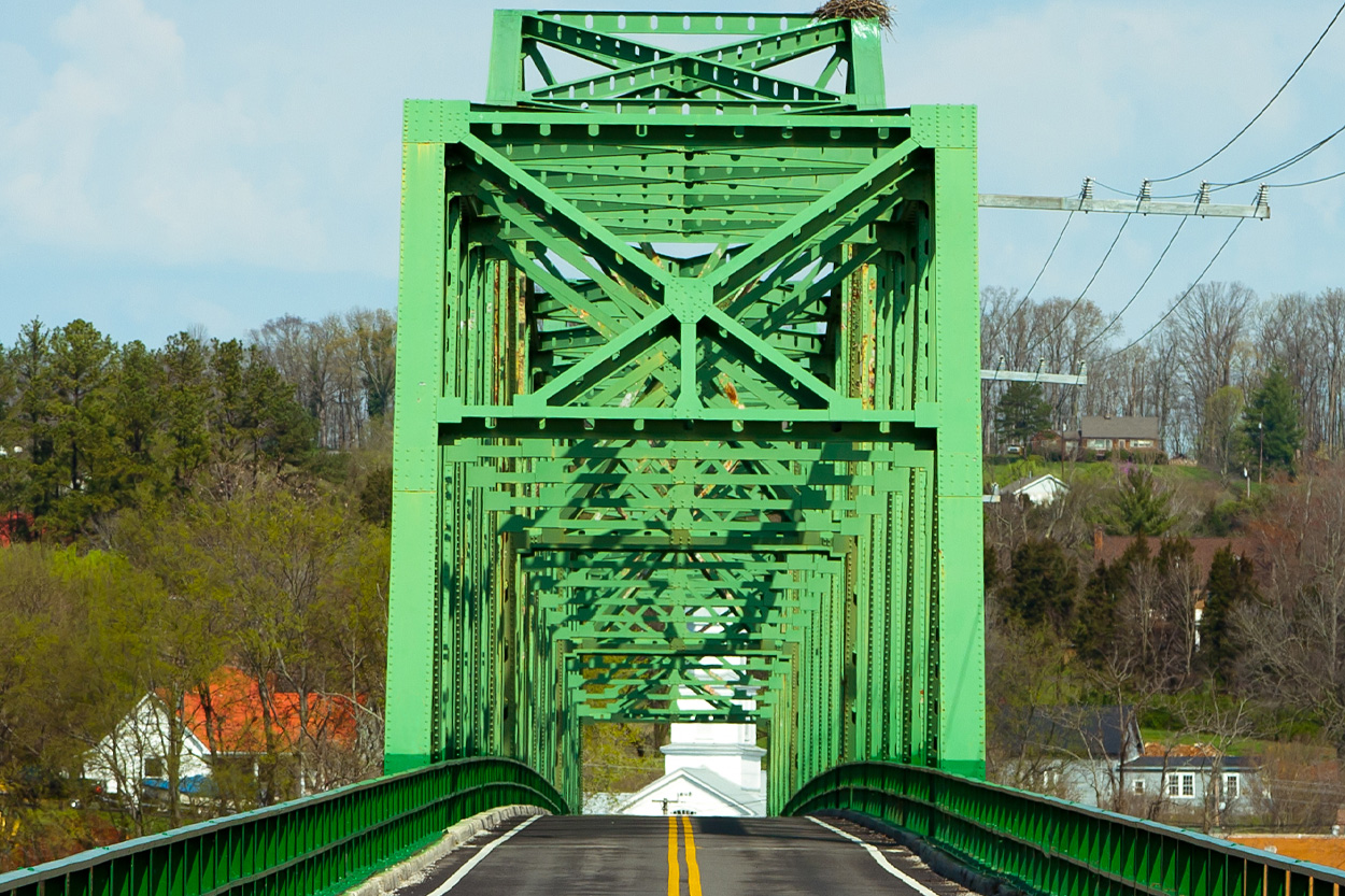 Green steel truss bridge representing Dandridge in Jefferson County, Tennessee