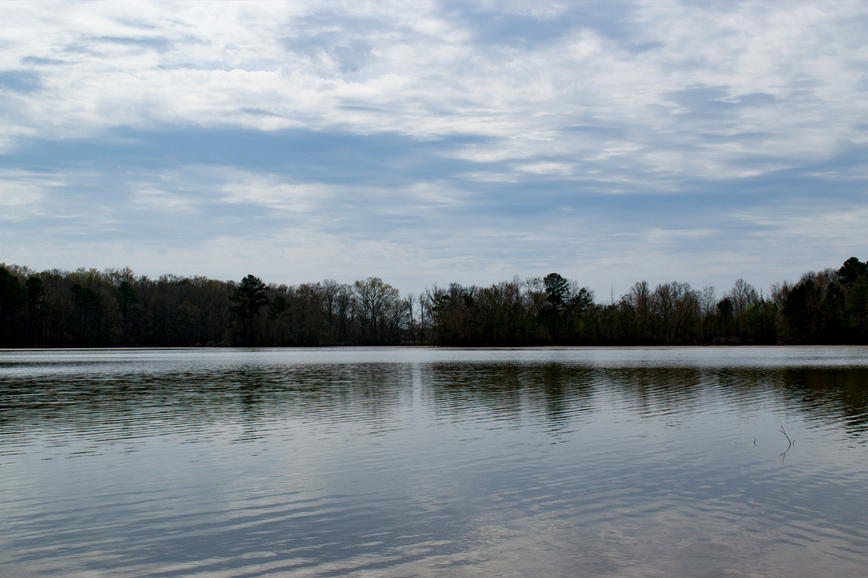Calm lake beneath a cloudy sky near Decatur in Meigs County, Tennessee