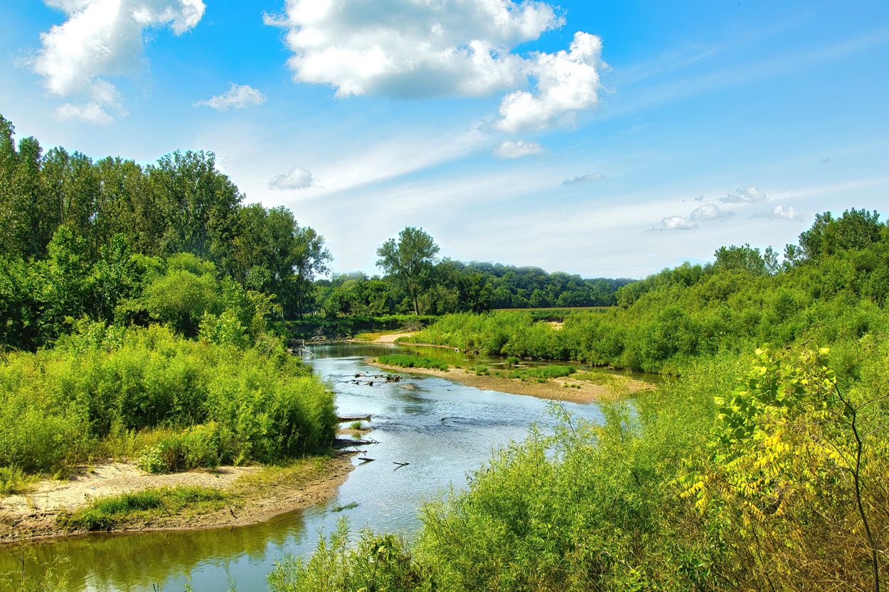 Winding creek flowing through a green rural landscape near Devonia, Tennessee
