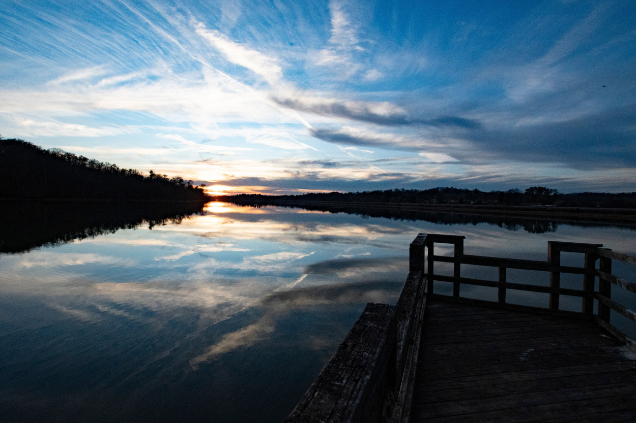 Wooden dock overlooking calm water at sunset near Loudon, Tennessee