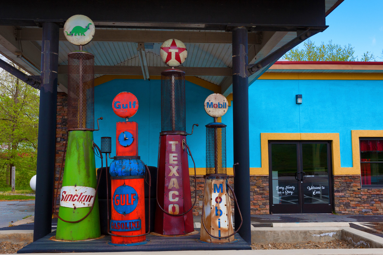 Vintage gasoline pumps outside a colorful storefront representing Morristown, Tennessee