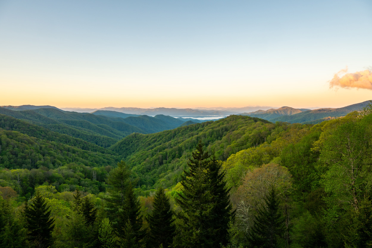 Forested Smoky Mountain ridges at sunset representing Sevierville in Sevier County, Tennessee