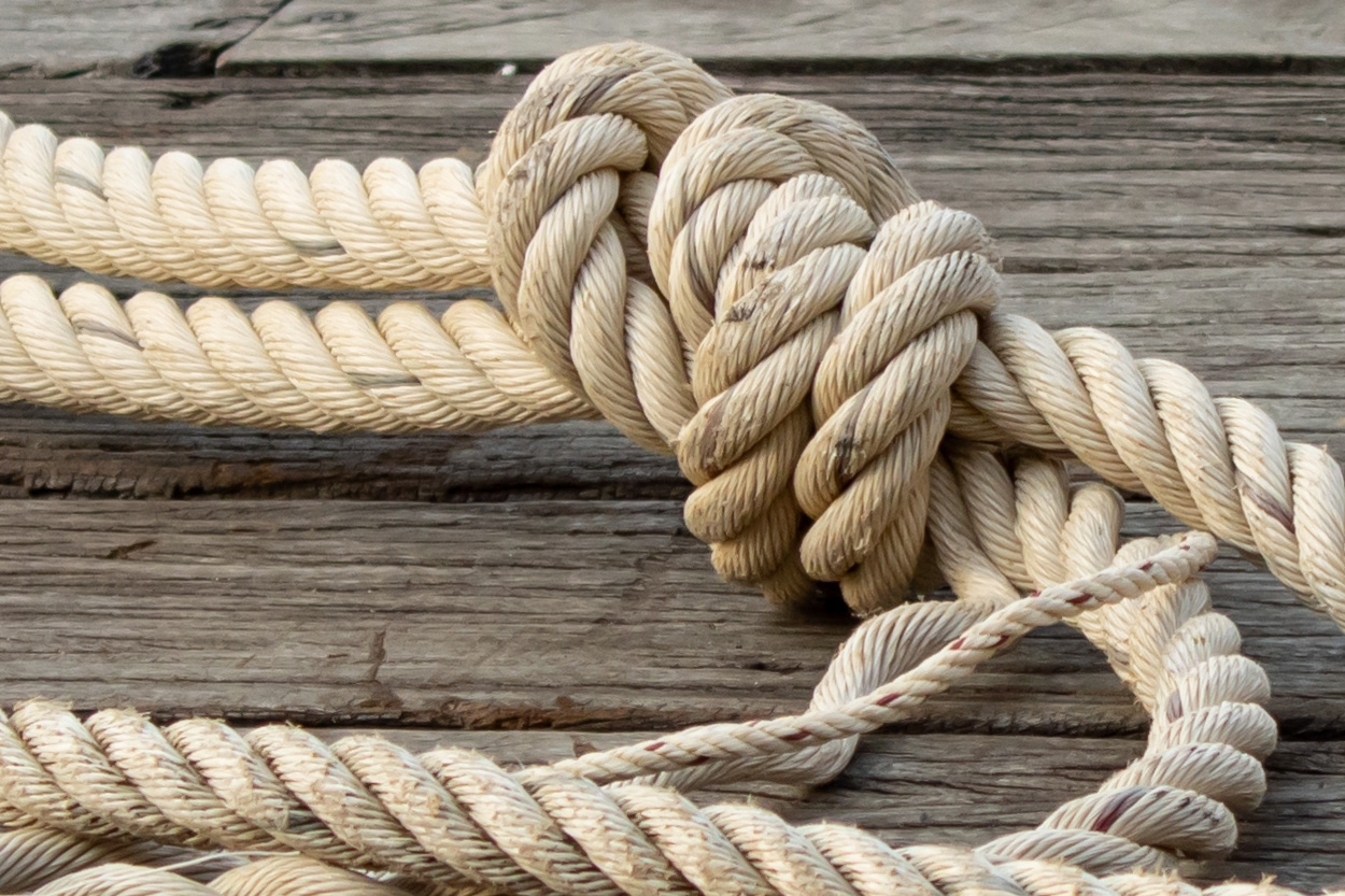 Coiled rope tied in a knot representing the Ten Mile community in East Tennessee