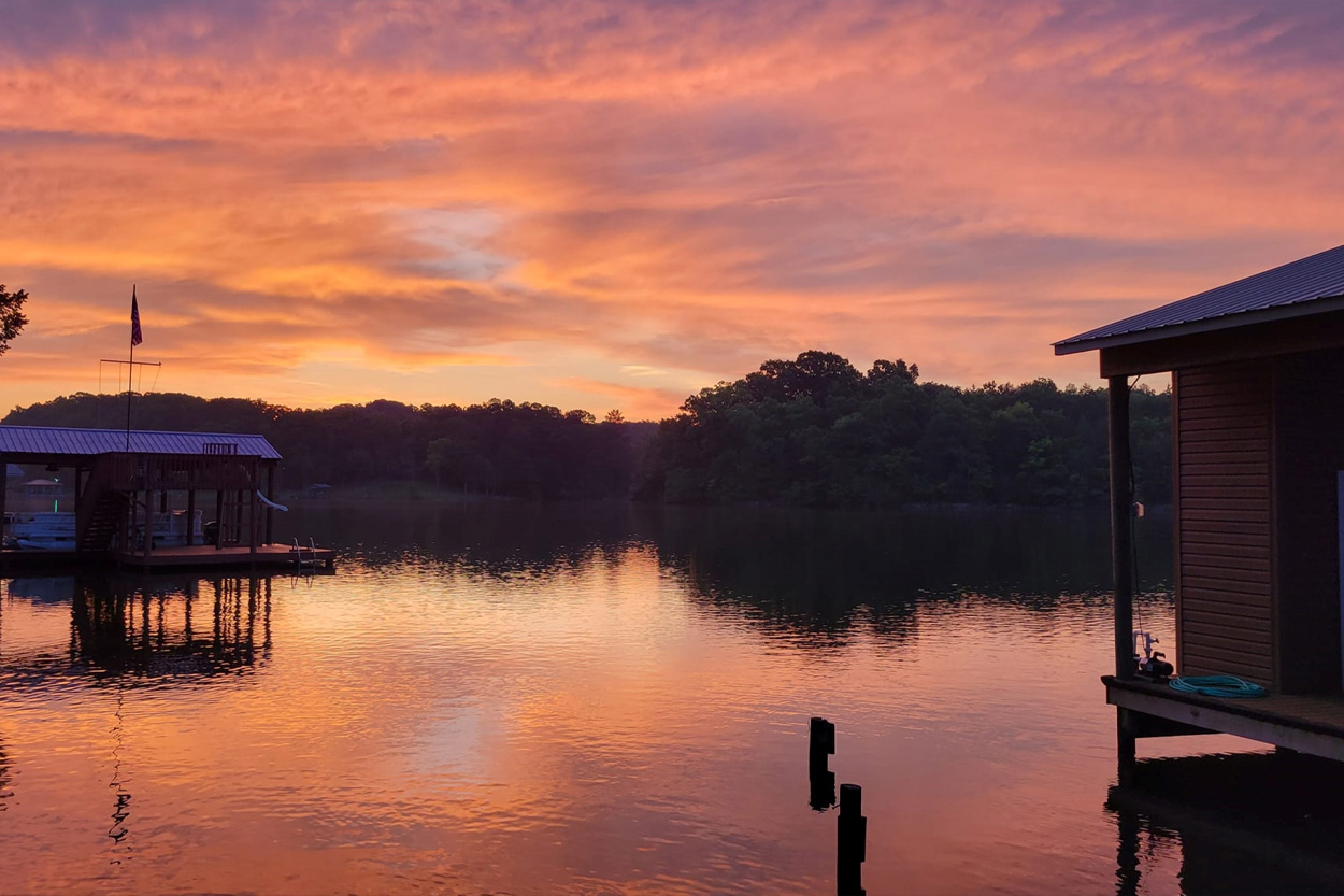 Calm Watts Bar Lake reflecting a colorful sunset near Rhea County, Tennessee