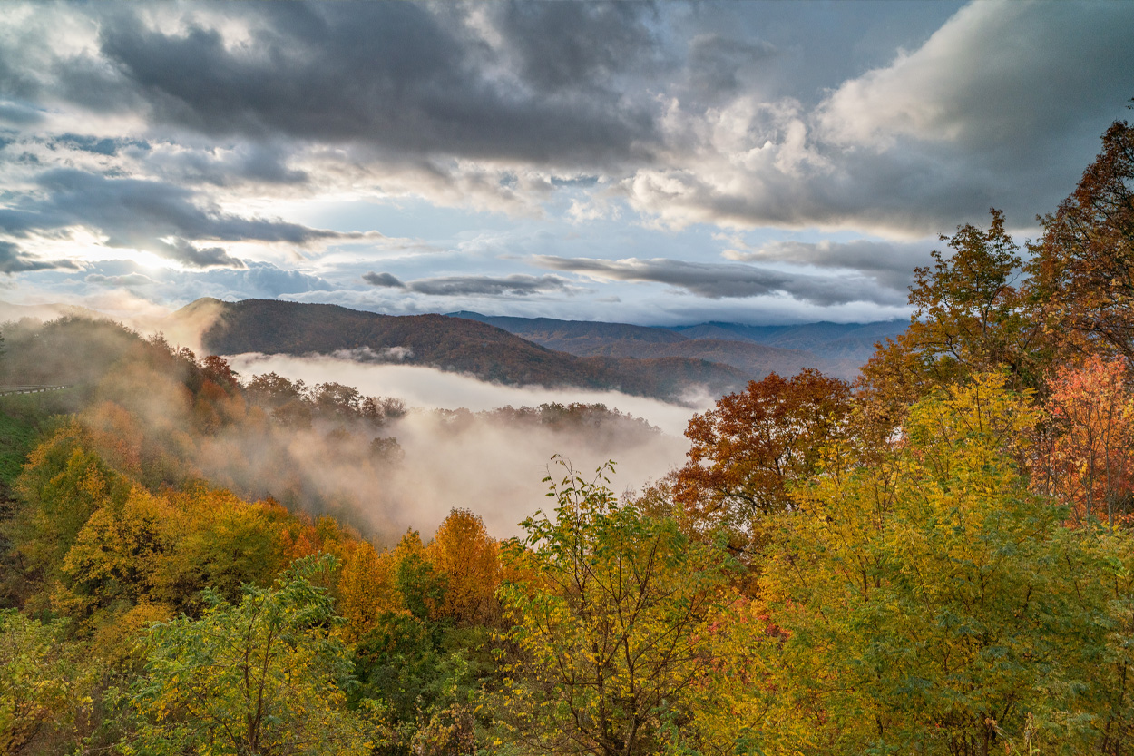 Mountain valley covered in morning mist and autumn foliage in Wears Valley, Tennessee