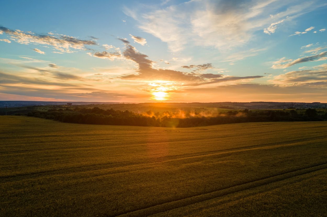 Golden sunset stretching across open farmland near Blaine in Grainger County, Tennessee