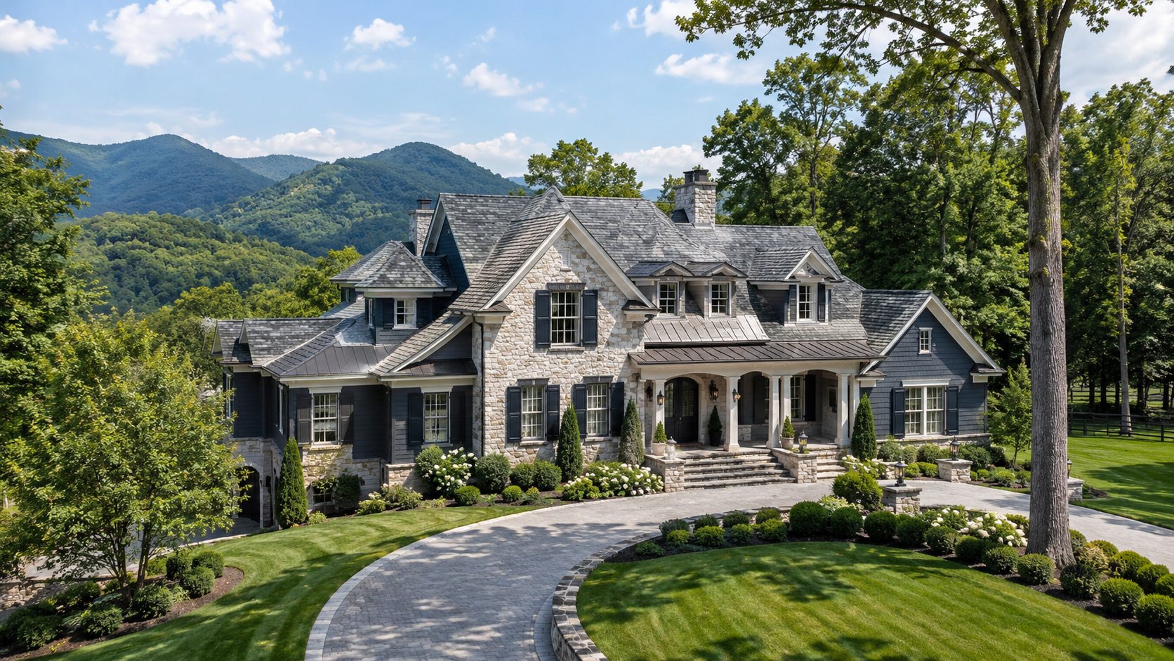 Grand Blount County estate with blue-gray architecture, landscaped acreage, private drive, and East Tennessee mountain views.
