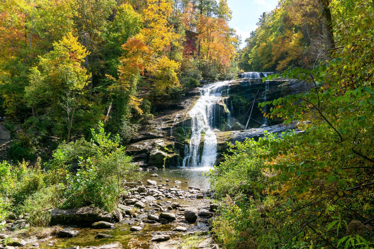 Woodland waterfall surrounded by autumn foliage near Coker Creek, Tennessee