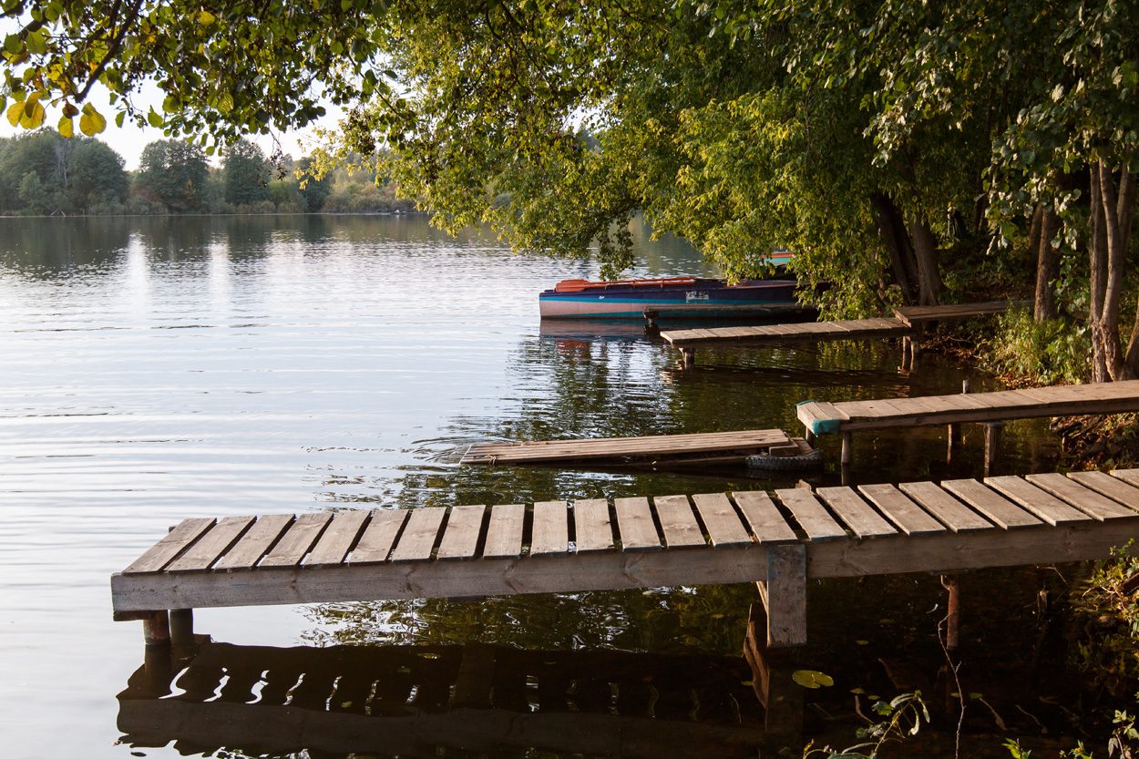 Wooden dock extending across a peaceful tree-lined lake near Joppa, Tennessee